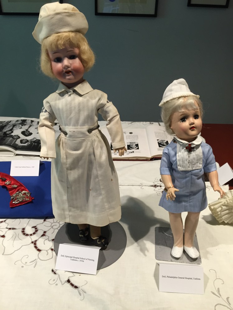 two dolls dressed as nurses