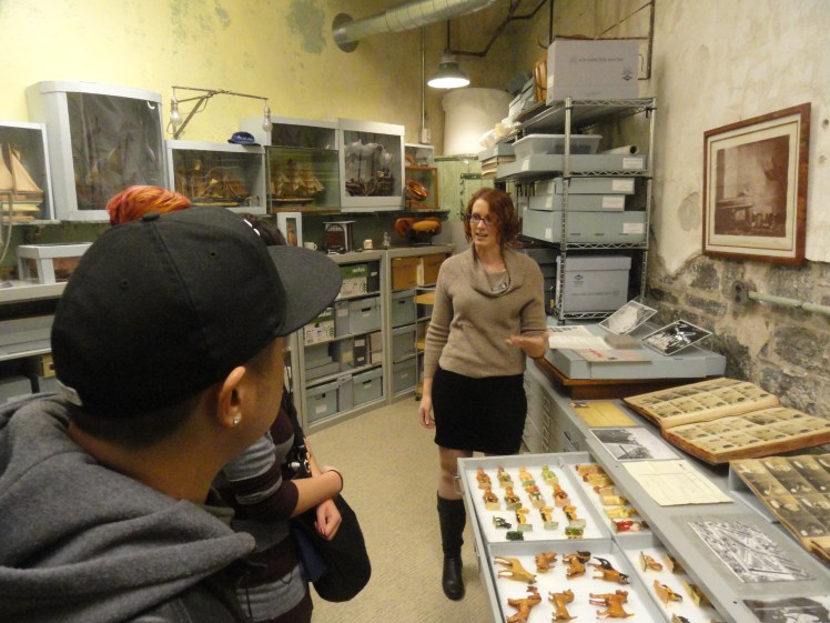 Erica Harman shows visitors toys made by prisoners