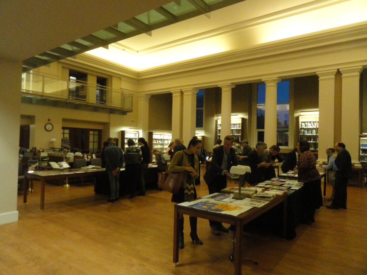 visitors looking at tables full of vintage ads at the Othmer Library