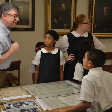Students looking at documents at the Redemptorist Archives
