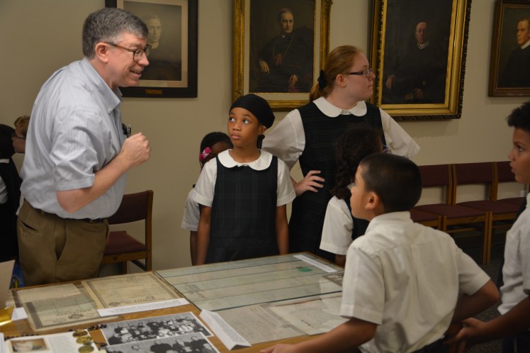 Students looking at documents at the Redemptorist Archives
