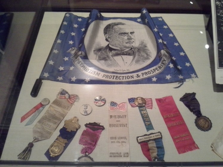 display of McKinley and Roosevelt campaign buttons and ribbons