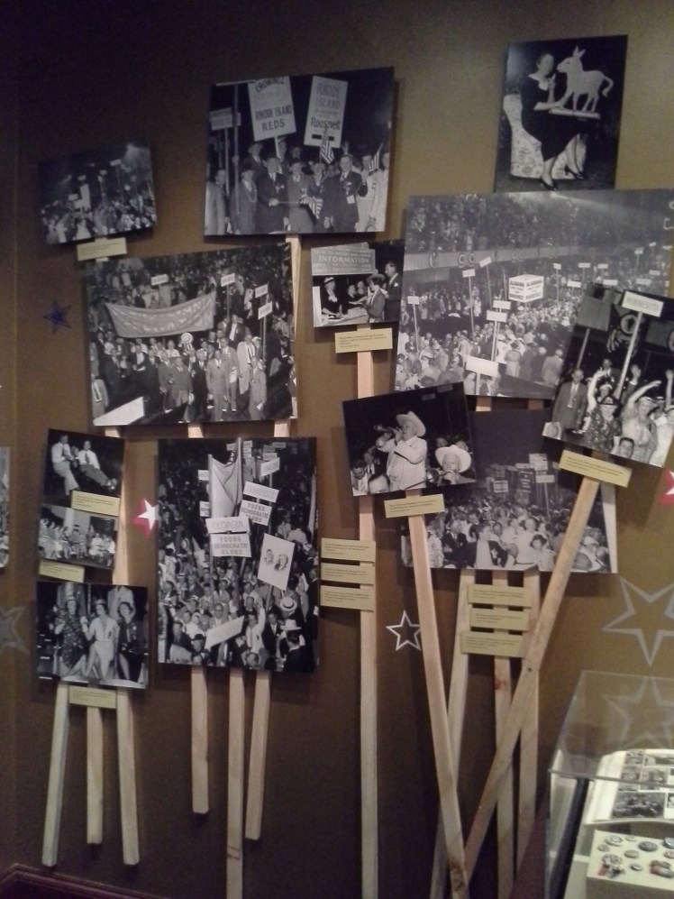 display of black and white campaign rally photographs