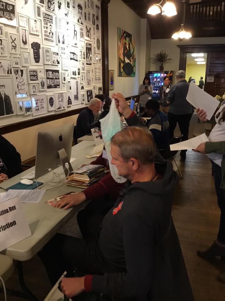 Volunteers and community members in the lobby participating in the digitization day.